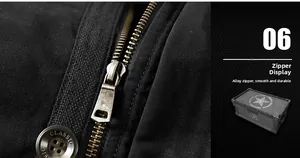 Detail of durable alloy zipper and classic engraved button on black winter jacket