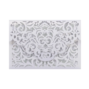 Detail of laser-cut pearl white envelope featuring intricate vine and floral patterns
