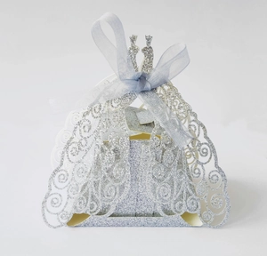 Laser cut hollow wedding dress candy box with silver glitter and blue ribbon