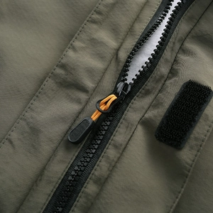 Men's lightweight waterproof outdoor jacket featuring army green ripstop fabric and zipper