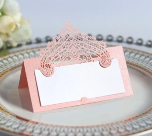 Laser cut pink lace wedding place card with crown hollow design on ceramic dinner plate