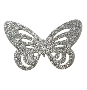 Detailed macro view of silver glitter hollowed-out butterfly wall sticker for party decor