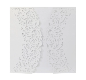 Detail of laser cut white pearlescent paper invitation with baroque scroll pattern