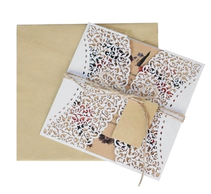 Laser cut floral wedding invitation suite with kraft paper card and rustic twine
