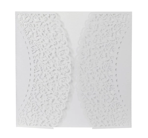 Intricate laser-cut white wedding invitation with elegant floral hollow patterns