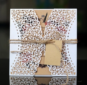 Laser-cut wedding invitation kit with rustic twine and vintage floral inner card detail