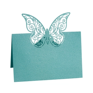 Teal laser-cut butterfly place cards with pearl finish for wedding and party table decor