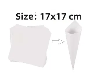 Detail showing 17x17cm white square paper folded into a DIY cone for wedding confetti