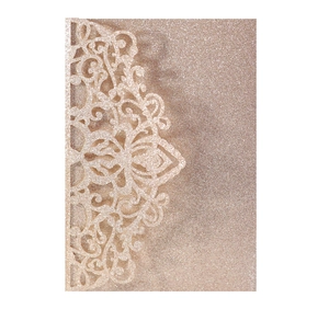 Close-up of champagne gold glitter laser-cut lace pocket for elegant wedding invitations