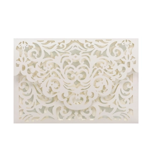 Detailed laser-cut vine and floral patterns on elegant white pearlescent wedding invitation