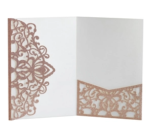 Detail of rose gold laser cut wedding invitation pocket with glitter finish texture