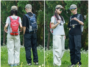 Detailed view of red and navy blue hiking backpacks with side mesh pockets and bungee cords