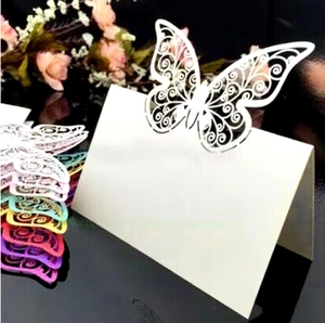 Laser-cut hollow butterfly place card with elegant patterns for wedding table setting