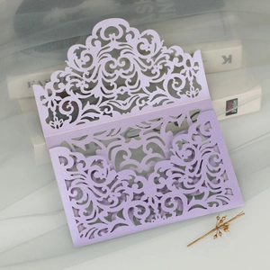 Detailed laser cut lavender wedding invitation sleeve with intricate floral lace patterns