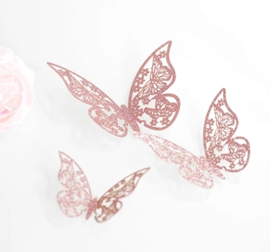 Mariposas 3D caladas en papel de purpurina oro rosa para decoración pared