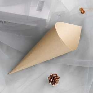 Close-up of a rustic brown kraft paper cone for wedding flower petals on soft grey mesh