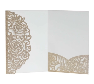 Detailed laser-cut rose patterns with gold glitter finish on white wedding invitation