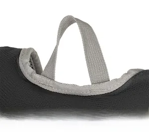 Macro detail of reinforced grey webbing handle and durable plaid fabric on the sport backpack