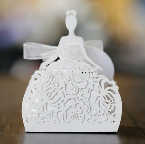 Detailed laser-cut white favor box with elegant princess silhouette and floral patterns
