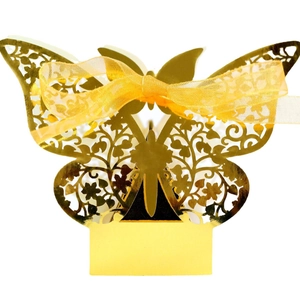 Golden hollow butterfly wedding candy box with laser-cut floral pattern and ribbon
