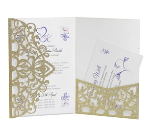 Detail of pink laser cut wedding invitation with gold glitter and floral inner sheet