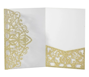 Macro shot of laser-cut gold glitter invitation pocket with floral lace and V-slot detail