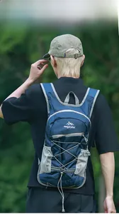 Detail of blue outdoor sports backpack with mesh straps and elastic cords for hiking