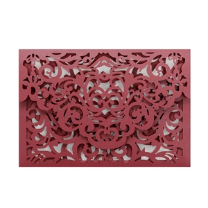 Elegant laser cut burgundy wedding invitation cover with intricate floral scroll pattern