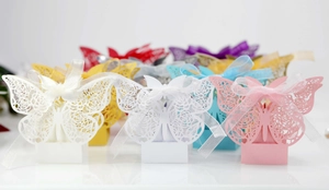Laser-cut butterfly candy boxes with rose patterns and ribbons for wedding decoration