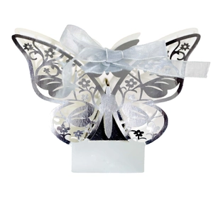 Hollow laser-cut butterfly candy box with blue ribbon in reflective silver finish