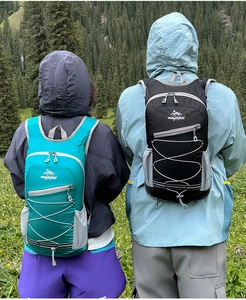 Close-up of lightweight hiking backpack with elastic cords and mesh side pockets
