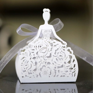 Laser-cut white wedding favor box featuring an elegant bride silhouette and rose patterns