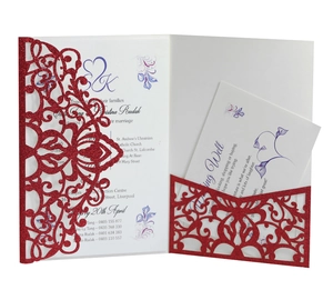 Detail of laser-cut glitter wedding invitation with red hollow cover and insert cards