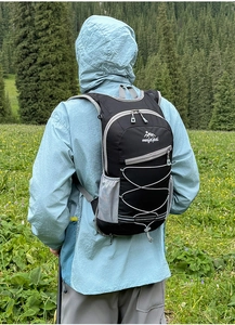 Outdoor sports backpack in black with elastic cords and side mesh pockets for hiking