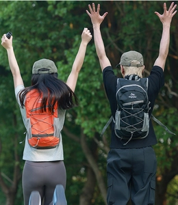 Outdoor hiking backpack with adjustable bungee cords and ripstop nylon texture