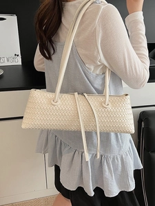 Minimalist beige woven leather baguette shoulder bag with stylish dual long straps