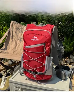 Macro shot of red tear-resistant nylon hiking backpack with side mesh pocket and cord system