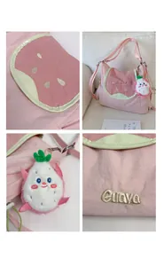 Detailed view of pink shoulder bag with fruit embroidery and plush dragon fruit charm