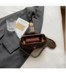 Detail view of large brown vintage leather crossbody bag interior showing spacious capacity