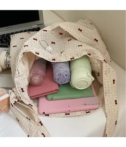 Interior view showing the large storage capacity of the floral tote bag with daily items
