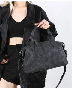 Detailed view of a dark grey vintage Boston bag with a textured finish and metal hardware