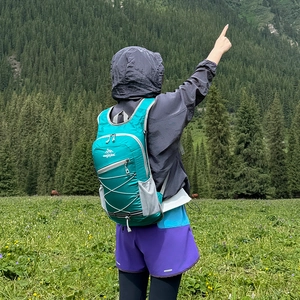 Lightweight turquoise outdoor backpack for hiking and cycling with elastic cord system