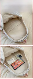 Detailed view of the white quilted backpack interior with pink lining and laptop pocket