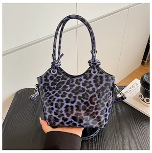 Purple leopard print tote bag in glossy finish showing silver ring and strap details