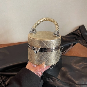 Mini gold cylindrical handbag with quilted pattern and metallic handle for women