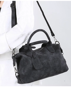 Detailed view of the dark grey matte Boston bag with its textured shoulder strap