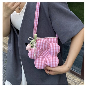 Detail of pink plaid canvas bucket bag with 3D flower, pearls and tulip charm