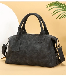 Detail of vintage charcoal grey Boston bag with matte texture and gunmetal hardware