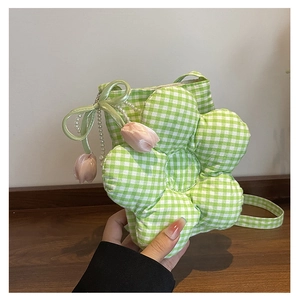 Detail of green checkered flower crossbody bag with pearl charms and tulip pendants