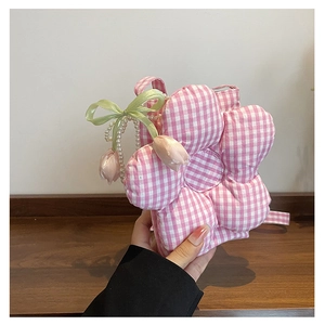 Detailed view of pink plaid flower-shaped crossbody bag with pearl strap and tulips